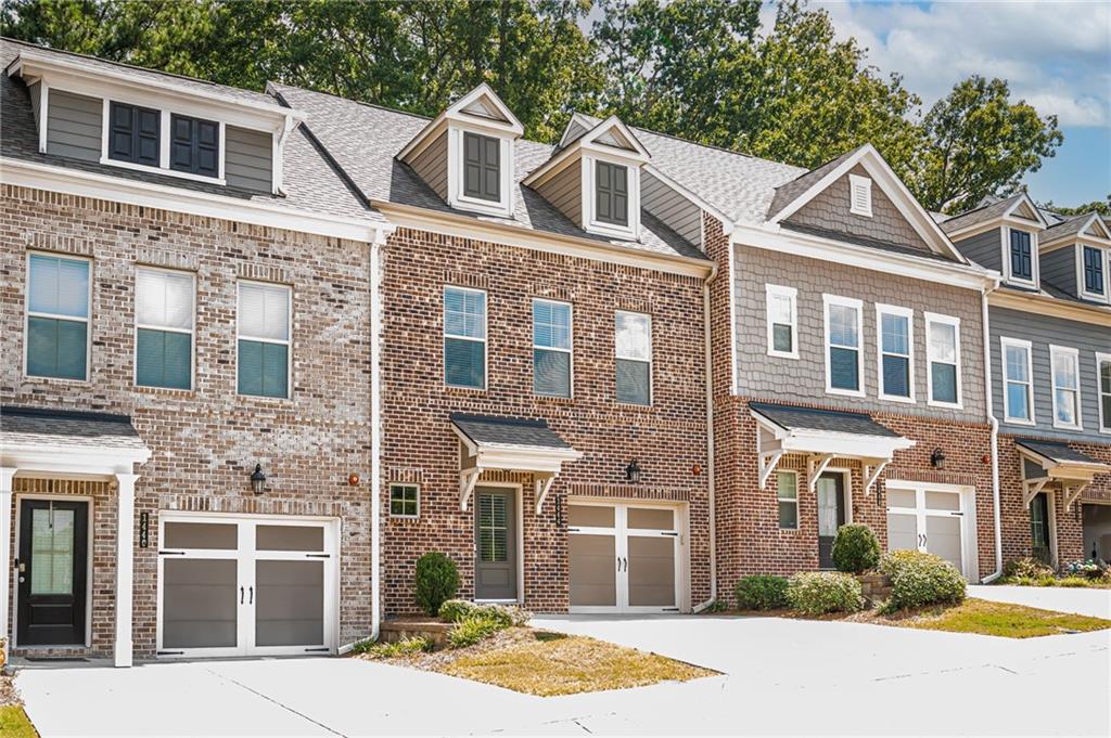 1444 Ridgebend Way Southeast Mableton, GA 30126 - Photo 3 of 34 a front view of a house with a yard