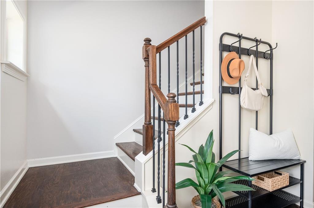 1444 Ridgebend Way Southeast Mableton, GA 30126 - Photo 5 of 34 a view of staircase with wooden floor and a potted plant