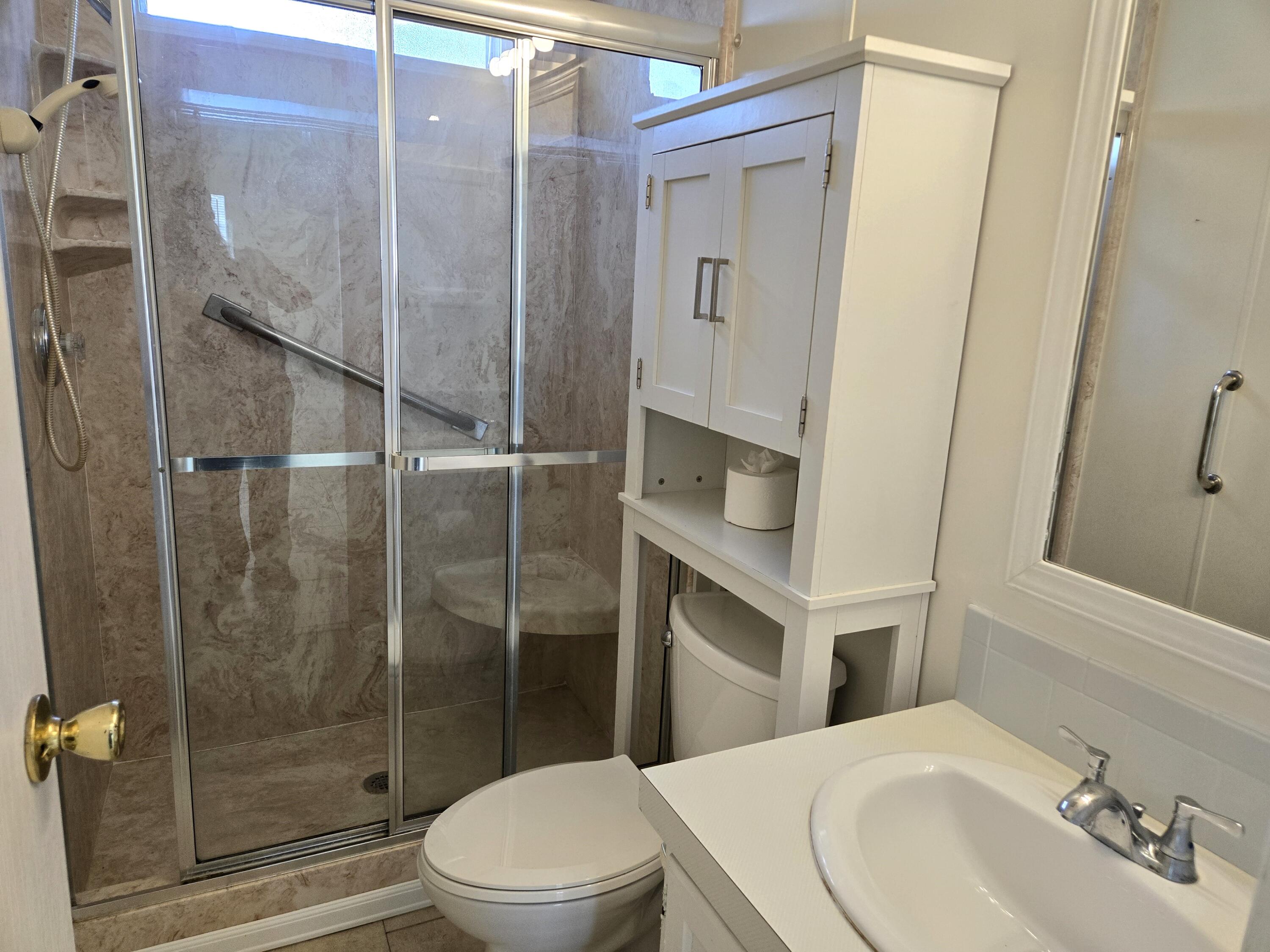 1586 Southwest 35th Circle Okeechobee, FL 34974 - Photo 24 of 37 a bathroom with a sink a toilet and shower