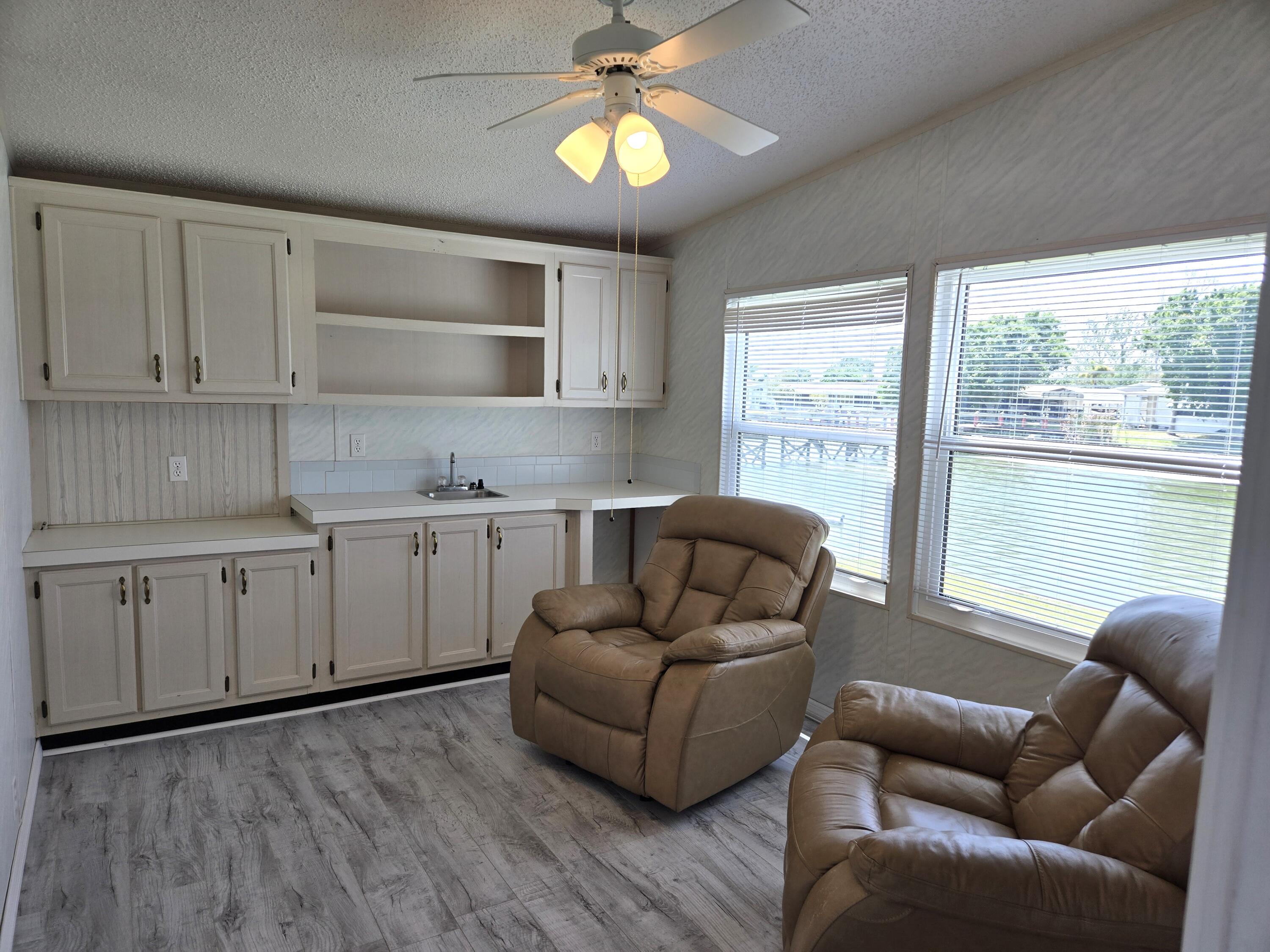 1586 Southwest 35th Circle Okeechobee, FL 34974 - Photo 25 of 37 a living room with furniture and a large window