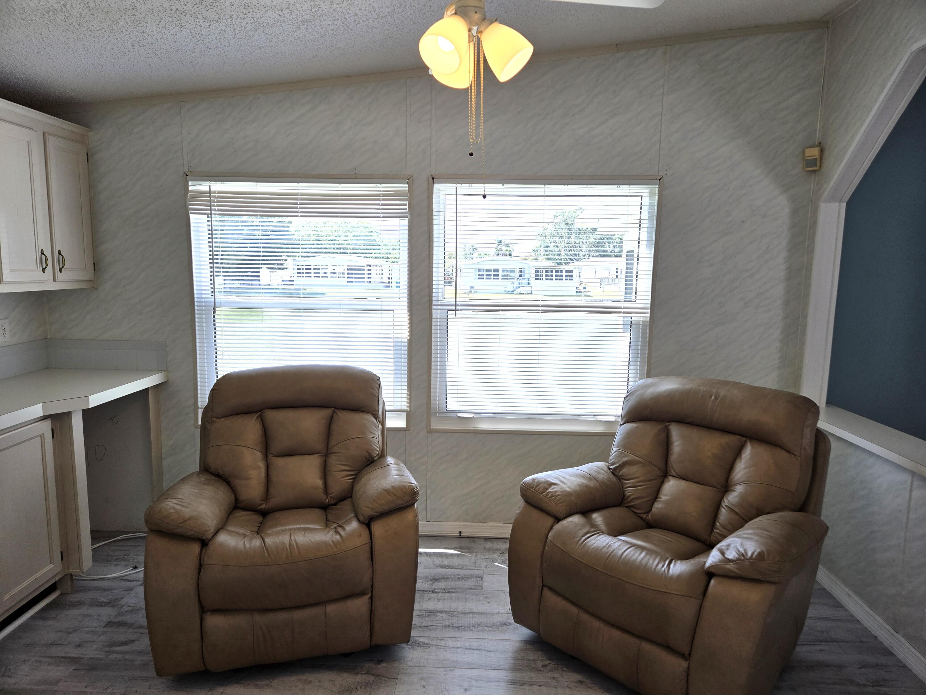 1586 Southwest 35th Circle Okeechobee, FL 34974 - Photo 27 of 37 a living room with furniture and a window