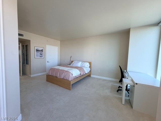 2777 Paradise Road, Unit 807 Las Vegas, NV 89109 - Photo 9 of 61 A well-lit bedroom provides ample space for relaxation and productivity.