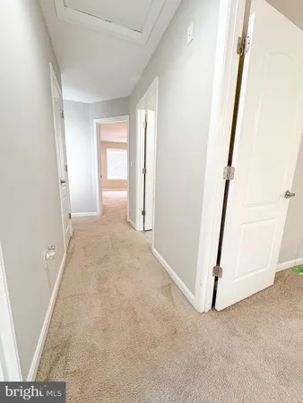 a view of a room with white walls