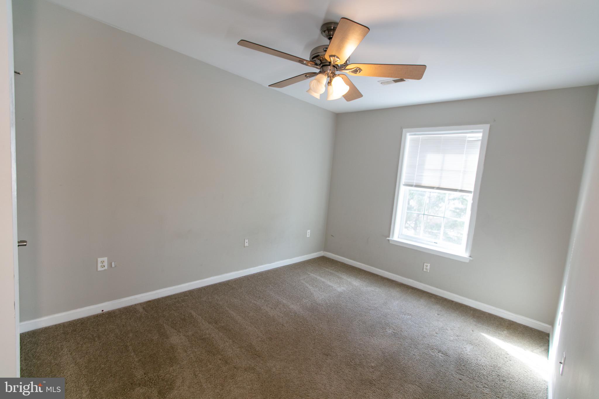 17 Ward Street Harrington, DE 19952 - Photo 23 of 34 an empty room with a window and a fan