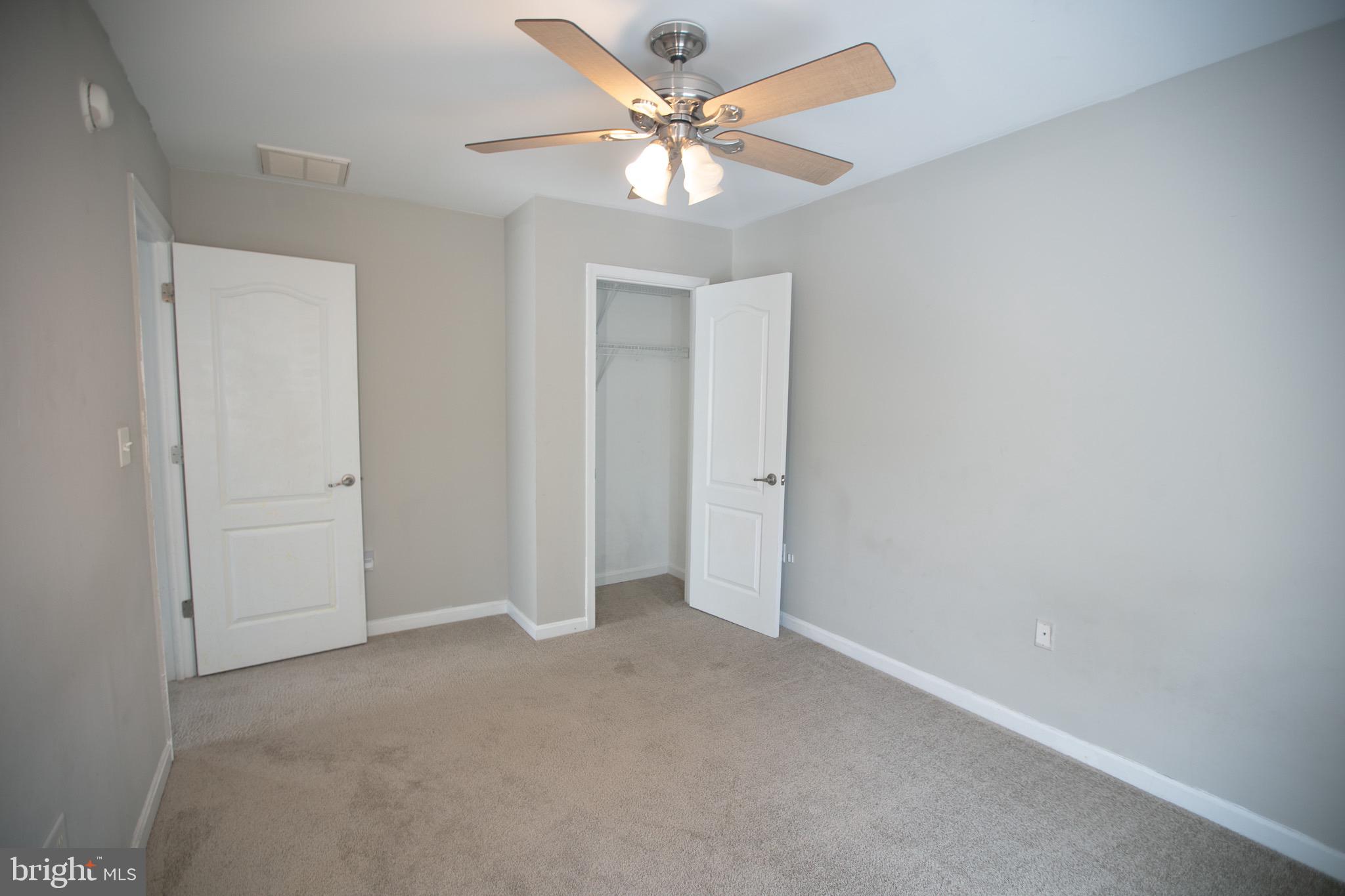 17 Ward Street Harrington, DE 19952 - Photo 24 of 34 an empty room with a chandelier fan and a chandelier fan