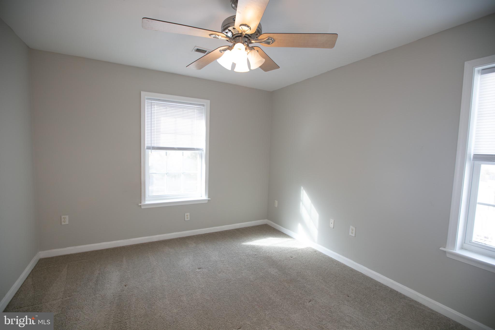 17 Ward Street Harrington, DE 19952 - Photo 25 of 34 an empty room with windows and fan