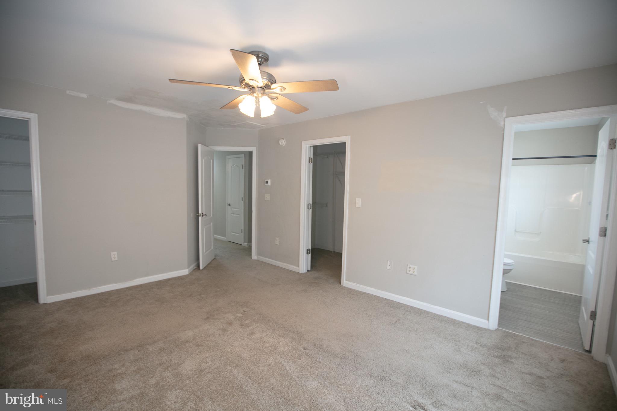 17 Ward Street Harrington, DE 19952 - Photo 27 of 34 an empty room with closet and a chandelier fan
