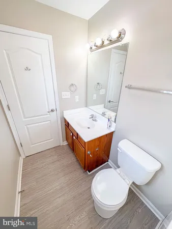 a bathroom with a tub sink and toilet