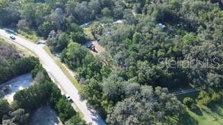 Little Ranch Spring Hill Spring Hill, FL 34610 - Photo 5 of 10 an aerial view of residential house with outdoor space and trees all around
