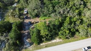 Little Ranch Spring Hill Spring Hill, FL 34610 - Photo 8 of 10 an aerial view of residential house with green space and trees all around