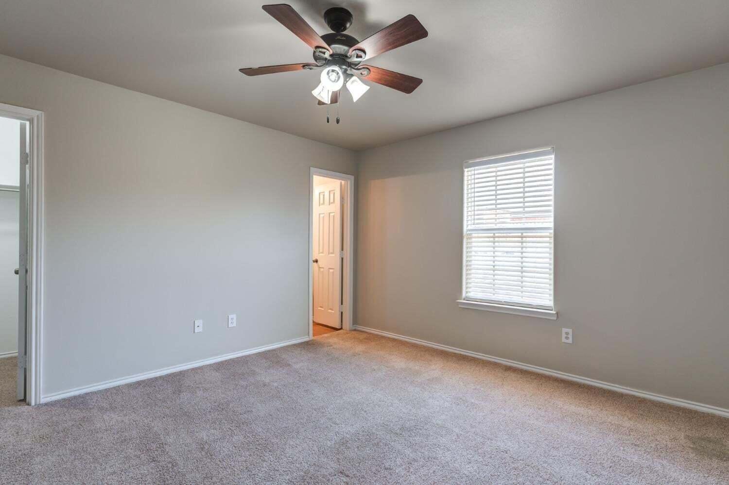 6554 92nd Street Lubbock, TX 79424 - Photo 13 of 17 a view of an empty room with a window