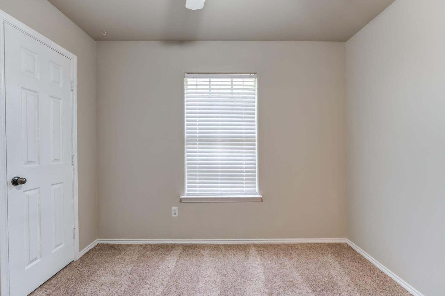 6554 92nd Street Lubbock, TX 79424 - Photo 14 of 17 an empty room with a window