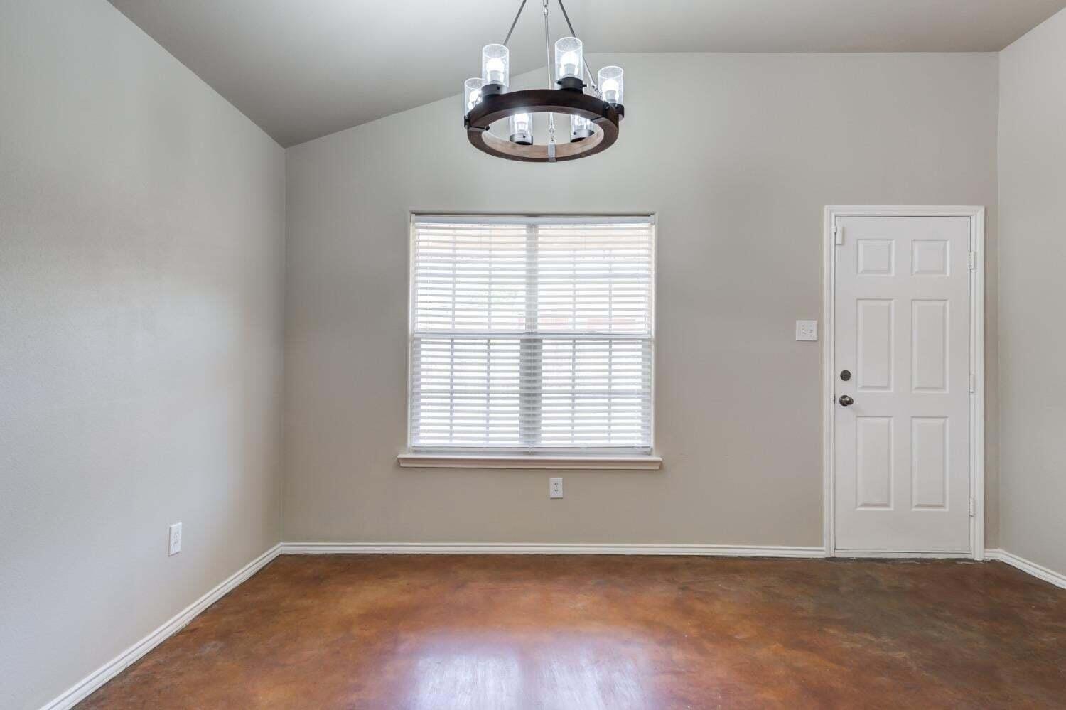 6554 92nd Street Lubbock, TX 79424 - Photo 9 of 17 an empty room with a window