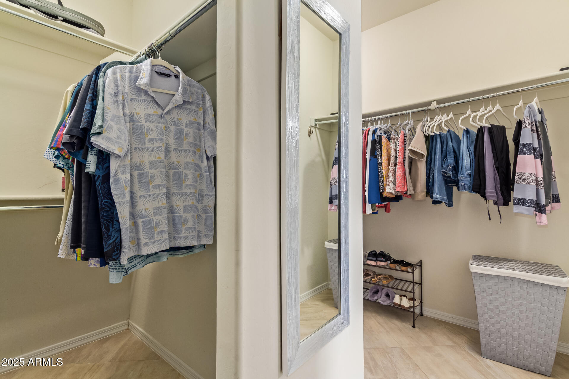 3516 East Megan Street Gilbert, AZ 85295 - Photo 28 of 60 a view of walk in closet with clothes and shoes