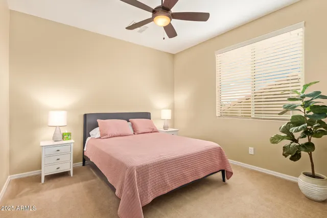 a view of living room with furniture and potted plant