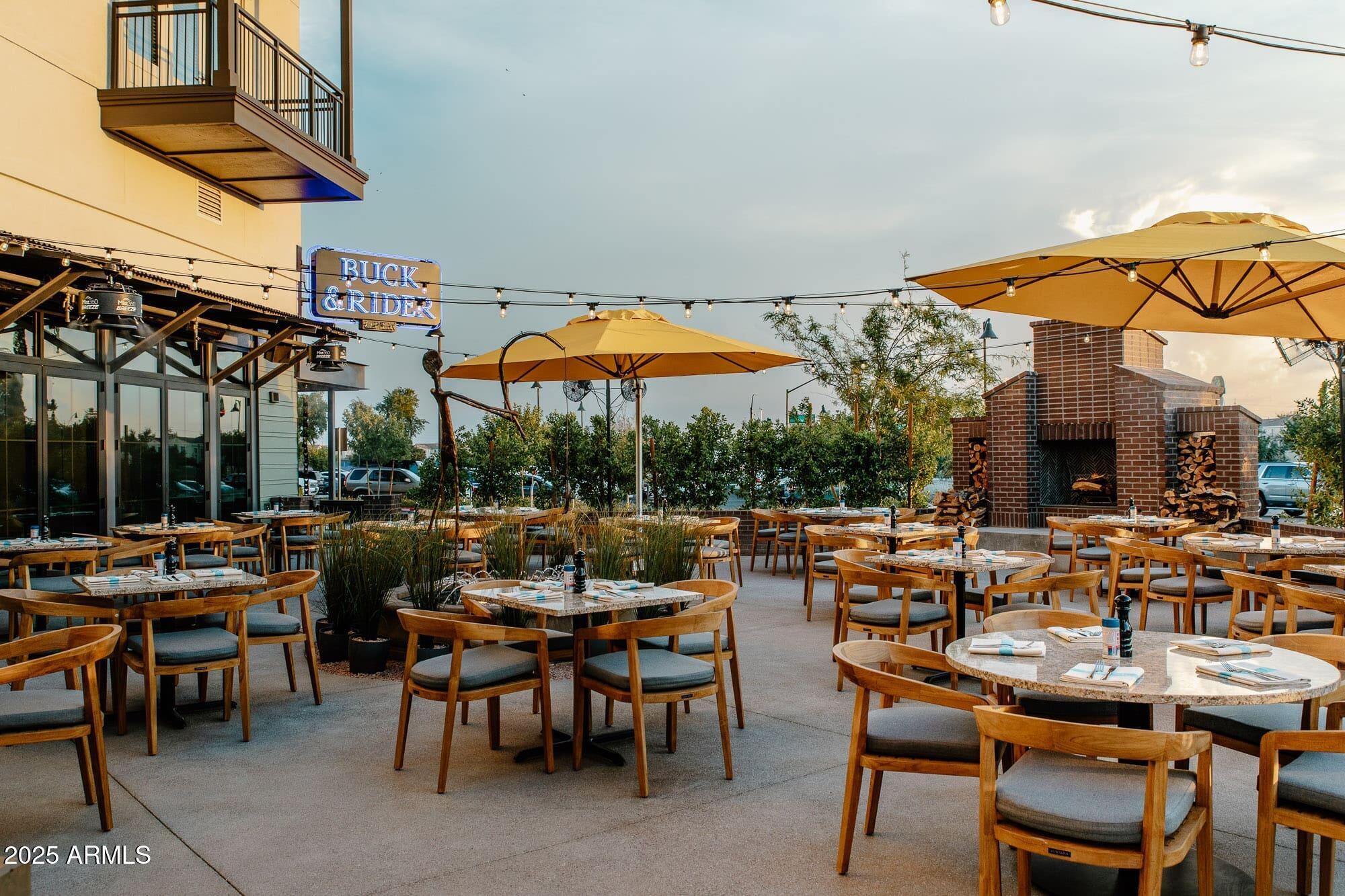 3516 East Megan Street Gilbert, AZ 85295 - Photo 59 of 60 a view of a patio with a table and chairs under an umbrella