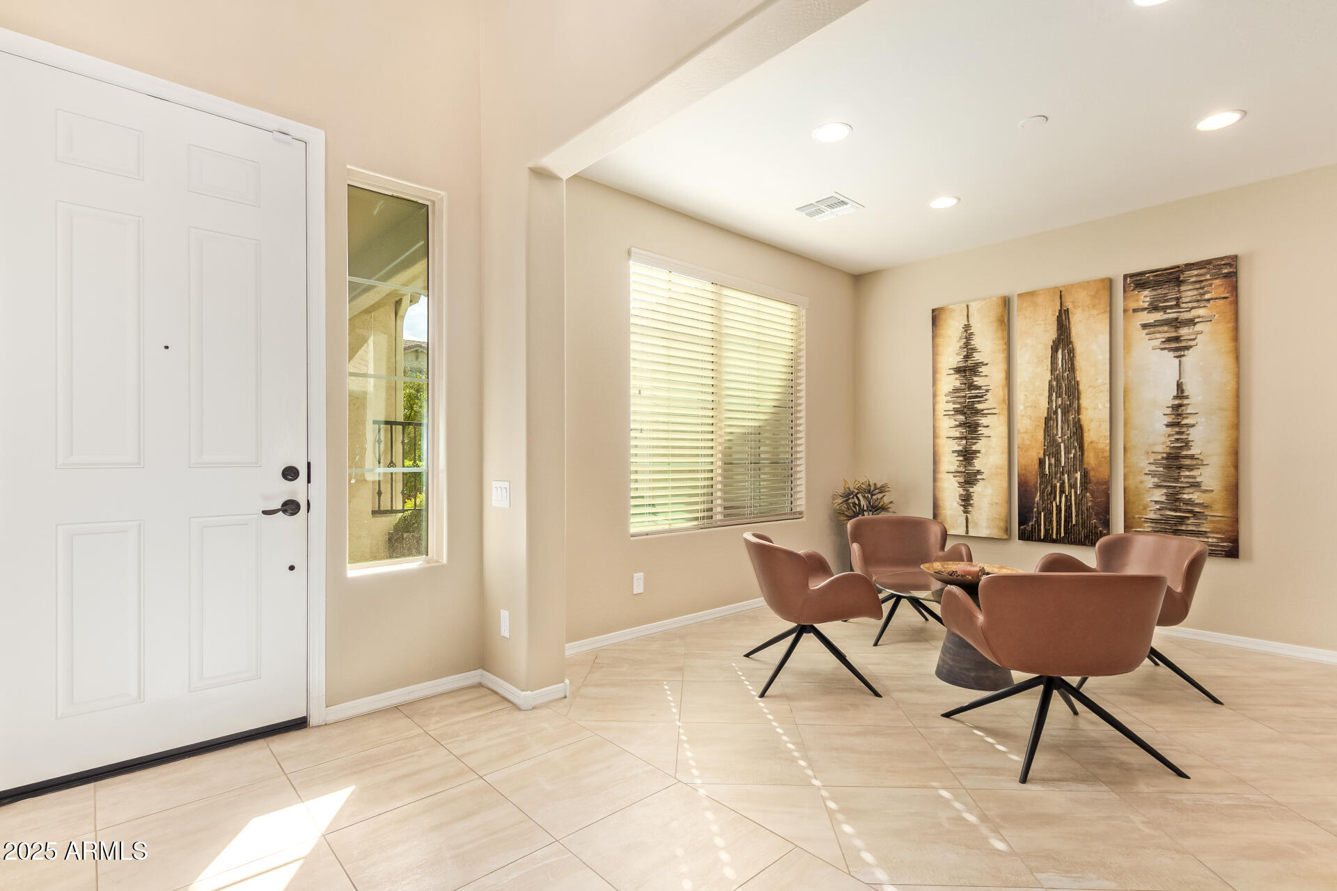 3516 East Megan Street Gilbert, AZ 85295 - Photo 7 of 60 a living room with furniture and large windows