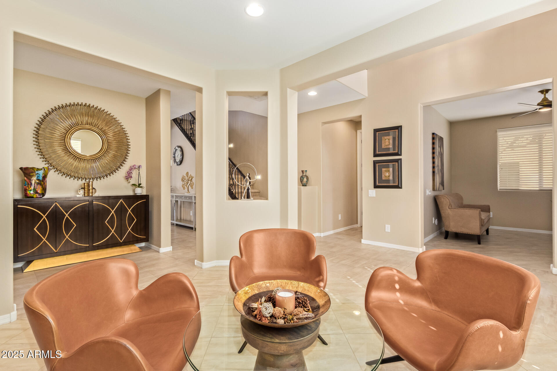 3516 East Megan Street Gilbert, AZ 85295 - Photo 9 of 60 a living room with furniture and a large mirror