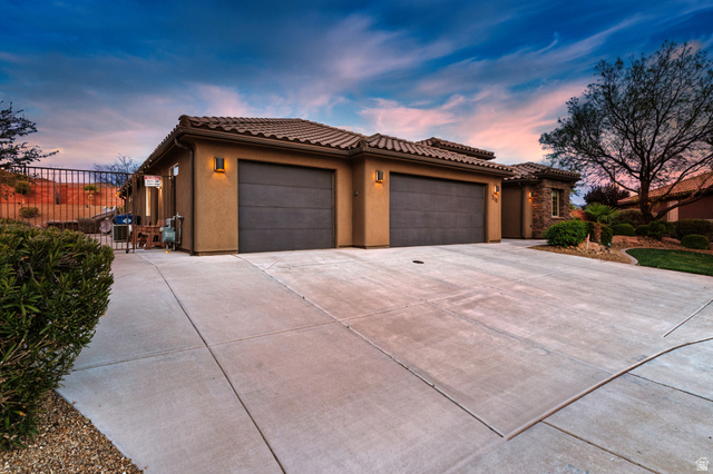 210 Talon Court Ivins, UT 84738 - Photo 47 of 60 View of front facade featuring stucco siding, a garage, concrete driveway, and a tiled roof
