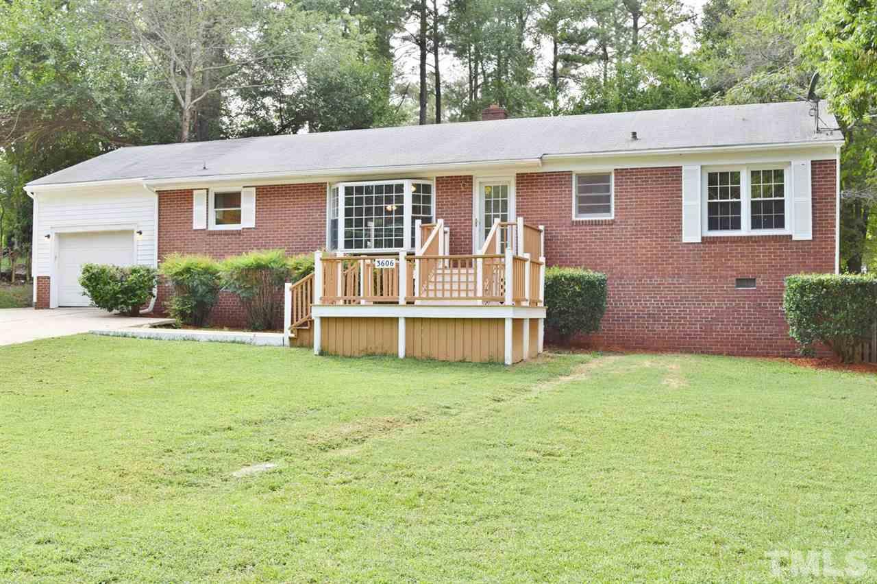 3606 Woodside Road Garner, NC 27529 - Photo 1 of 16 a front view of a house with a yard