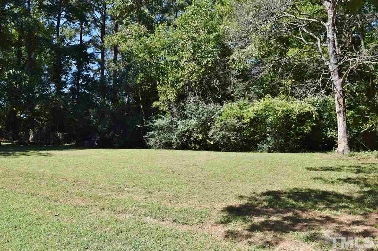 3606 Woodside Road Garner, NC 27529 - Photo 16 of 16 a view of grassy field with trees