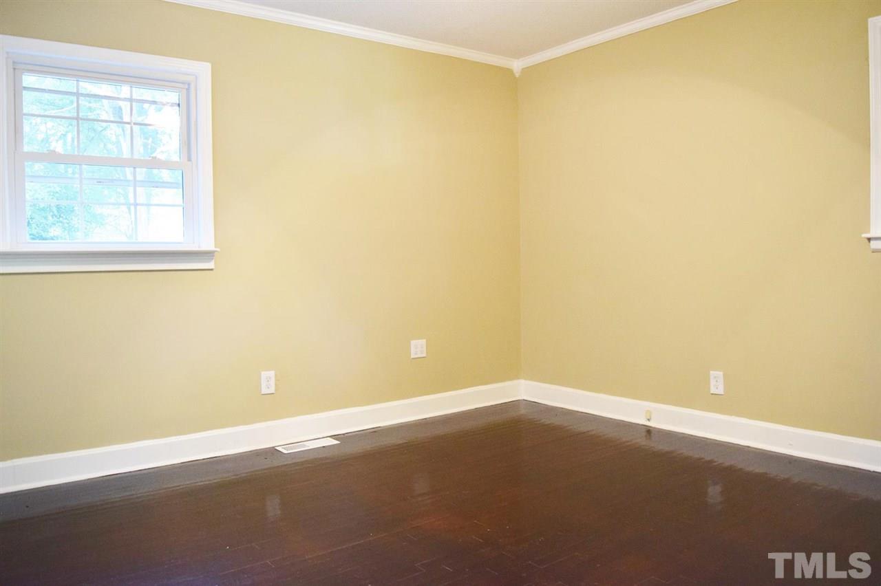 3606 Woodside Road Garner, NC 27529 - Photo 10 of 16 an empty room with a empty space and a window
