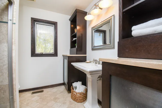 a bathroom with a sink and a mirror