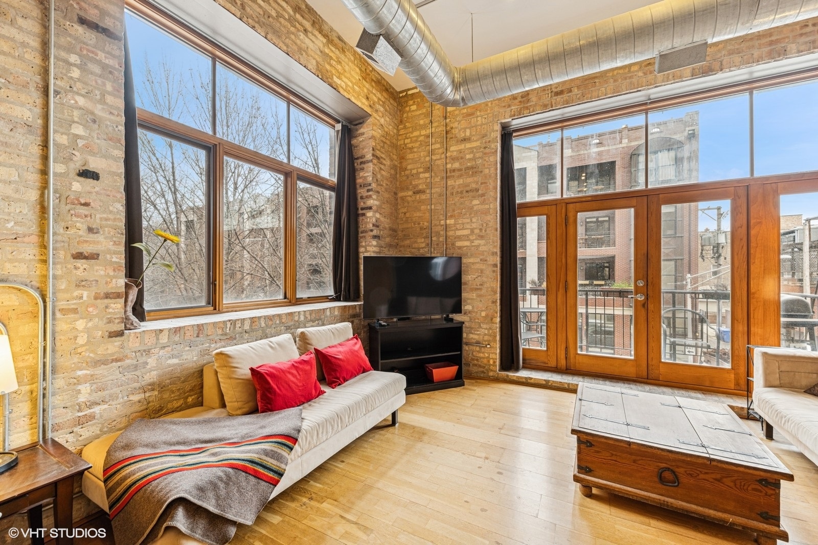 2101 West Rice Street, Unit 204 Chicago, IL 60622 - Photo 4 of 14 a living room with furniture or couch and a flat screen tv