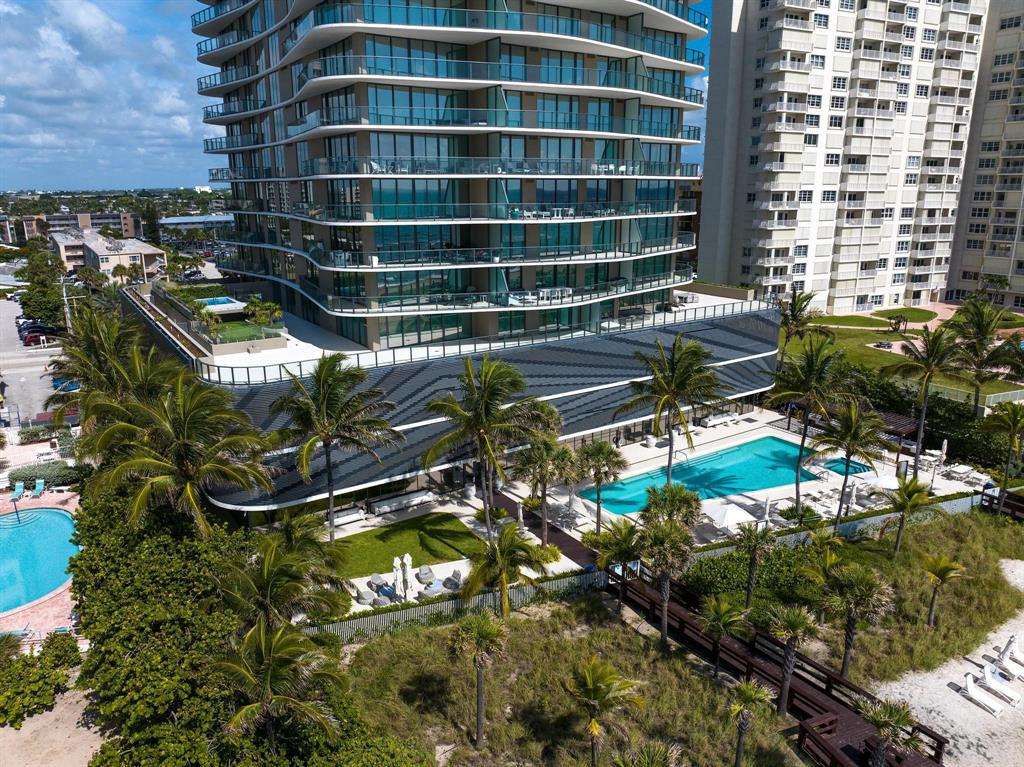 730 North Ocean Boulevard, Unit 405 Pompano Beach, FL 33062 - Photo 41 of 47 a backyard of a house with barbeque oven and outdoor seating