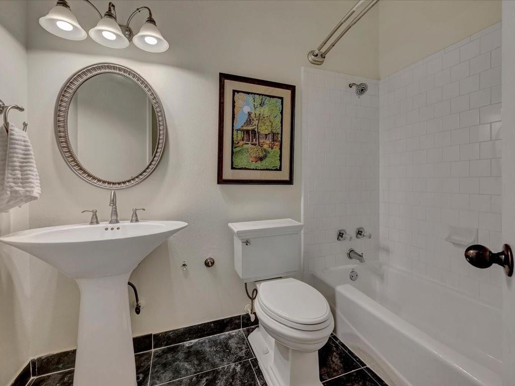 206 Cascade Court Lufkin, TX 75901 - Photo 21 of 29 a bathroom with a toilet a sink and a mirror