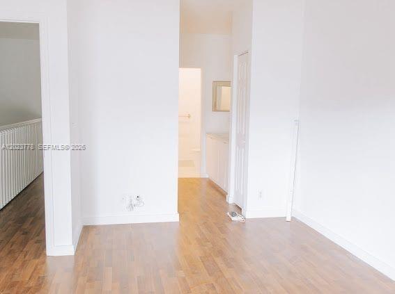 10245 Vía Hibiscus, Unit 10245 Boca Raton, FL 33428 - Photo 15 of 28 a view of empty room with wooden floor