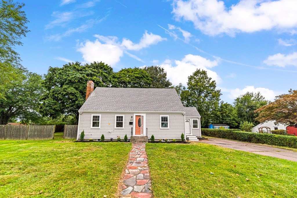 a aerial view of a house with yard patio and fire pit