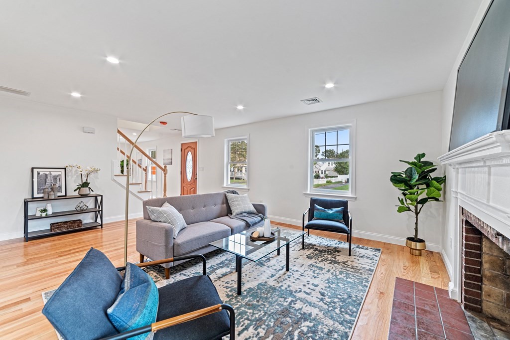 40 Howe Street Quincy, MA 02169 - Photo 11 of 42 a living room with furniture and a potted plant
