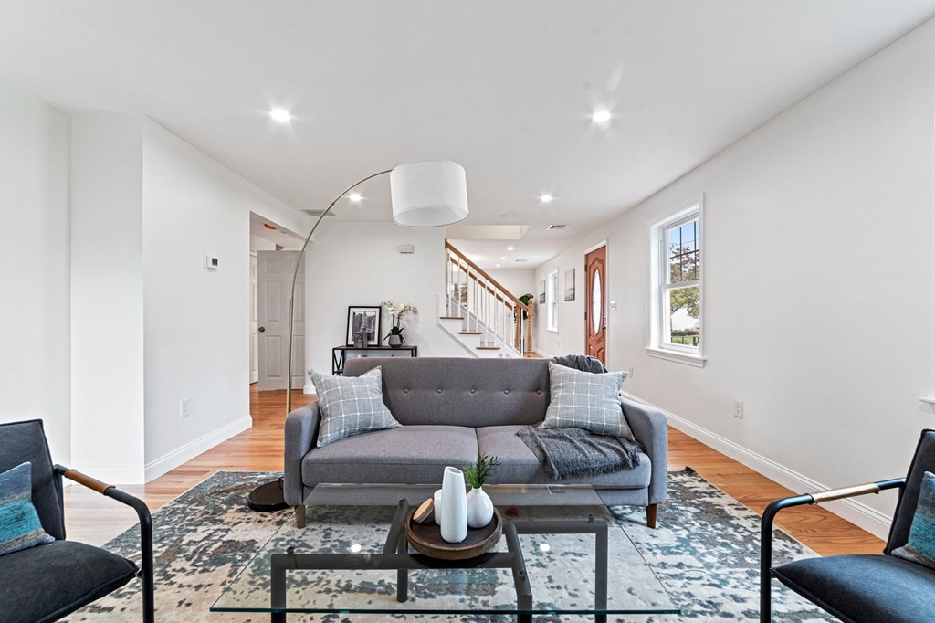 40 Howe Street Quincy, MA 02169 - Photo 12 of 42 a living room with furniture and a rug