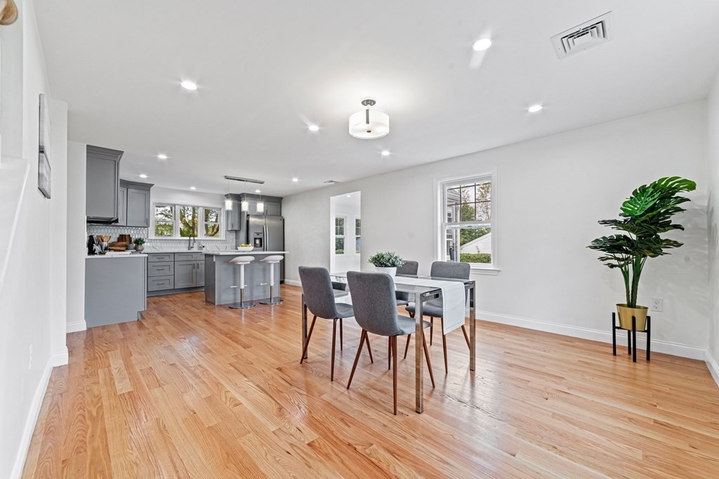 40 Howe Street Quincy, MA 02169 - Photo 14 of 42 a view of a dining room with furniture and wooden floor