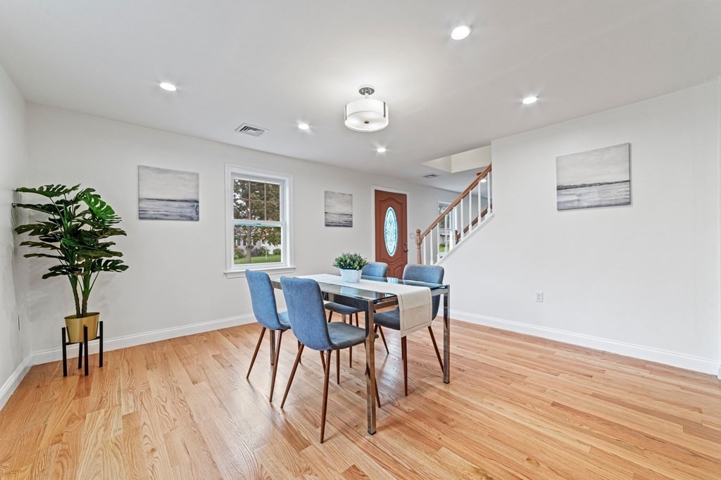 40 Howe Street Quincy, MA 02169 - Photo 15 of 42 a view of a dining room with furniture window and wooden floor