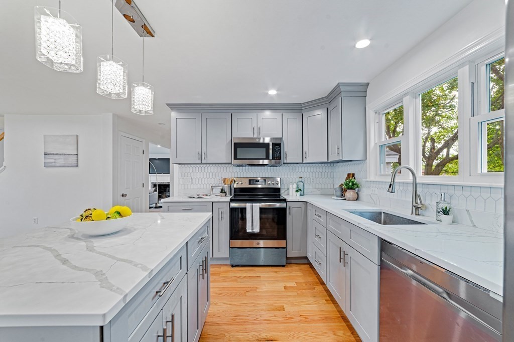 40 Howe Street Quincy, MA 02169 - Photo 19 of 42 a kitchen with a sink a counter space appliances and cabinets