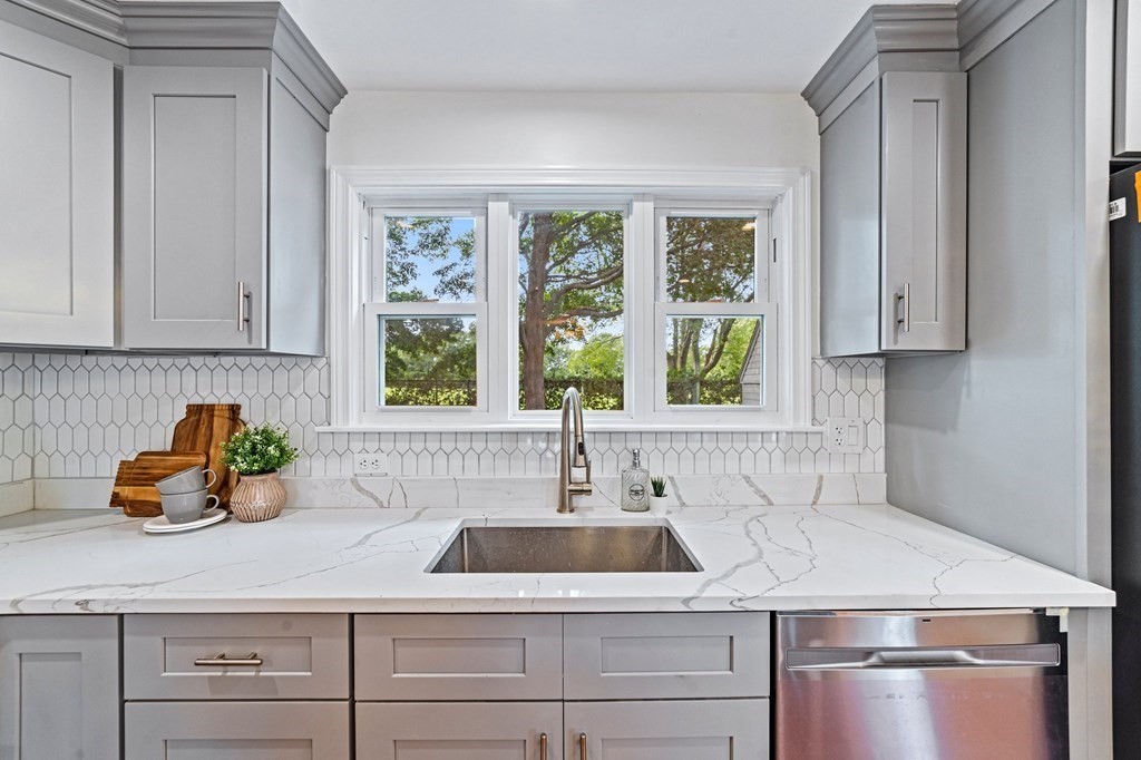 40 Howe Street Quincy, MA 02169 - Photo 20 of 42 a kitchen with a sink cabinets and window