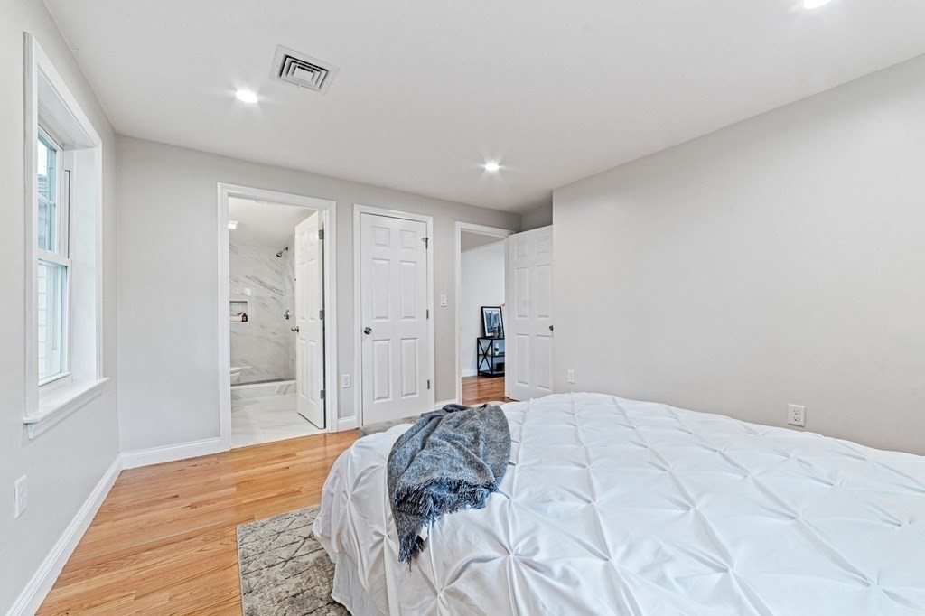 40 Howe Street Quincy, MA 02169 - Photo 24 of 42 a bedroom with a bed and a window