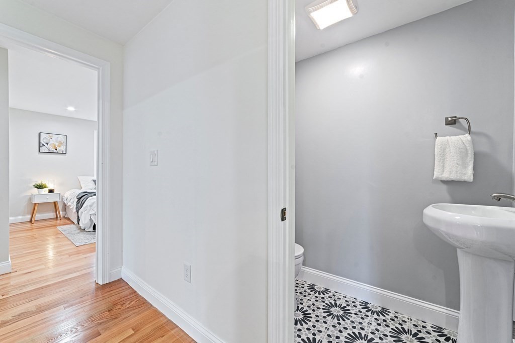 40 Howe Street Quincy, MA 02169 - Photo 25 of 42 a bathroom with a sink and a mirror