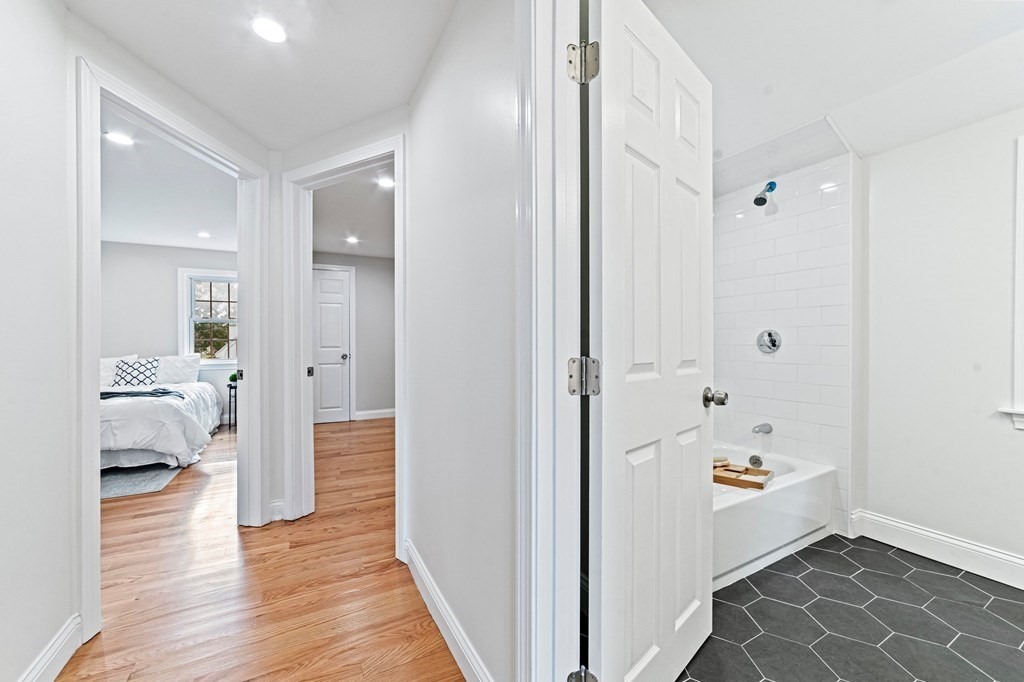 40 Howe Street Quincy, MA 02169 - Photo 27 of 42 a bathroom with a bathtub and a hallway