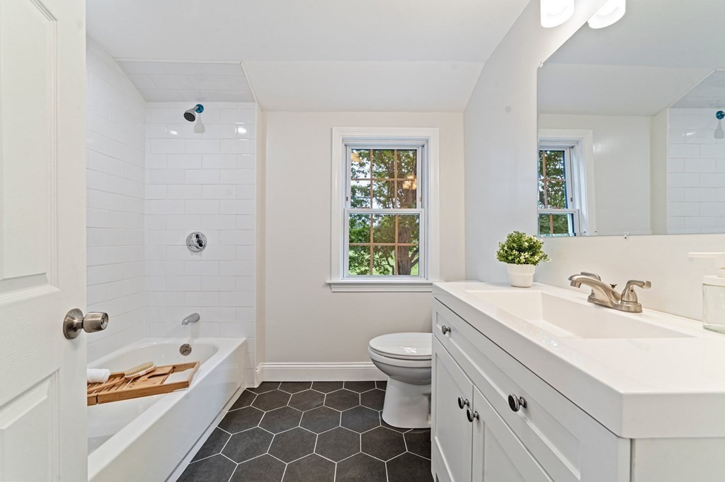 40 Howe Street Quincy, MA 02169 - Photo 28 of 42 a bathroom with a sink toilet a shower and a bathtub