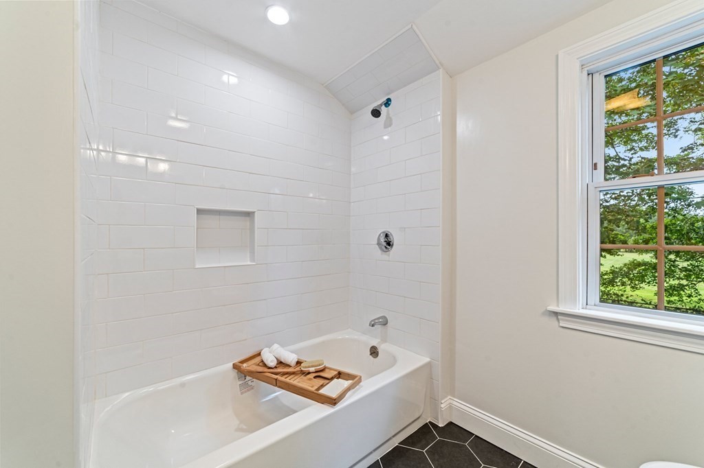 40 Howe Street Quincy, MA 02169 - Photo 29 of 42 a bathroom with a tub and a window