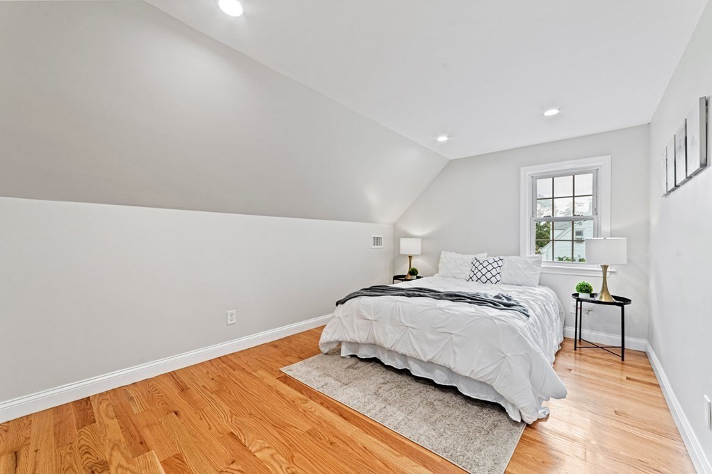 40 Howe Street Quincy, MA 02169 - Photo 32 of 42 a bedroom with a bed and window