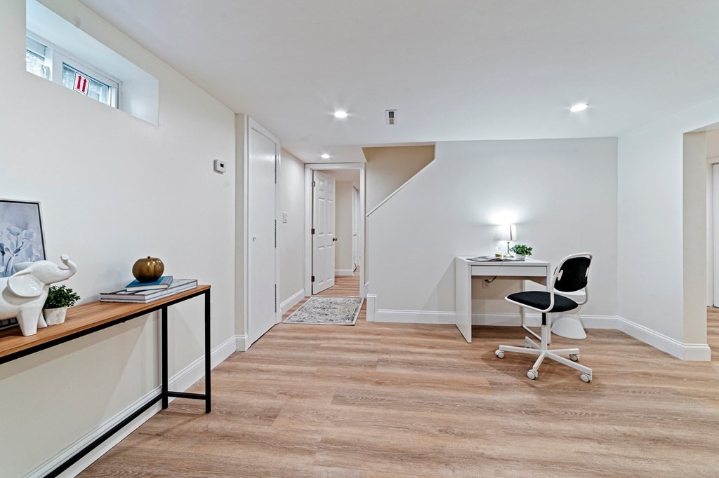 40 Howe Street Quincy, MA 02169 - Photo 35 of 42 a room with gym equipment and wooden floor