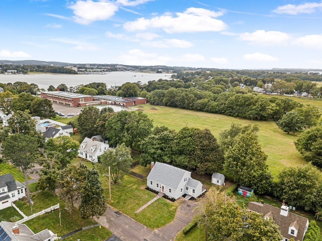 40 Howe Street Quincy, MA 02169 - Photo 4 of 42 a view of lake with lawn chairs and large trees
