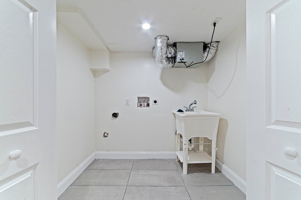 40 Howe Street Quincy, MA 02169 - Photo 41 of 42 a bathroom with a sink and toilet