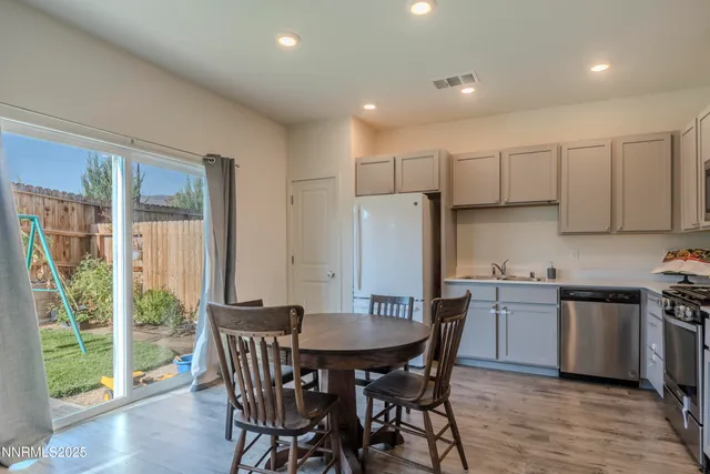 a kitchen with stainless steel appliances a refrigerator stove and microwave
