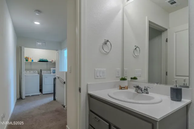a bedroom with a bed lamp and window