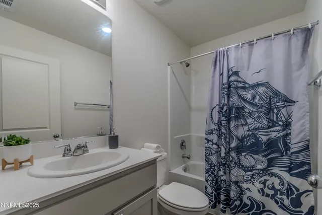 a bedroom with a bed a couch and dresser